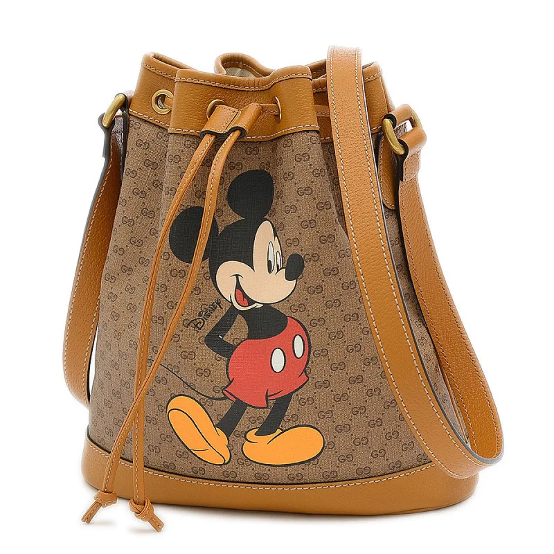 Ladies Gucci shoulder bags with a tassel decorationGucci Disney Collaboration Mickey Mini GG Supreme Small Bucket Shoulder 602691