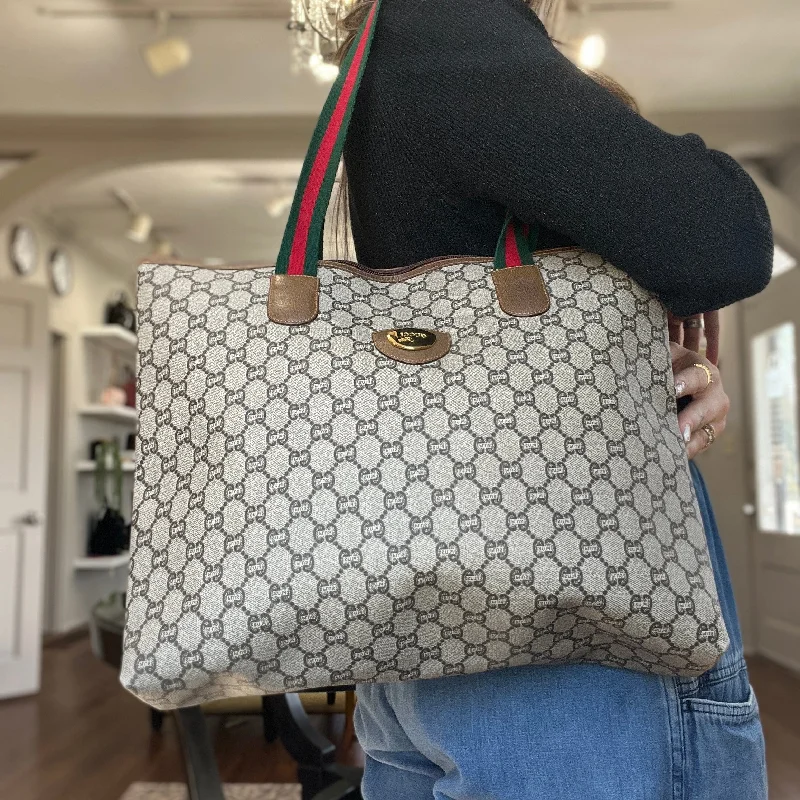 Women Gucci bags with a zip - around closure for securityGucci GG Plus Top Zip Web Tote