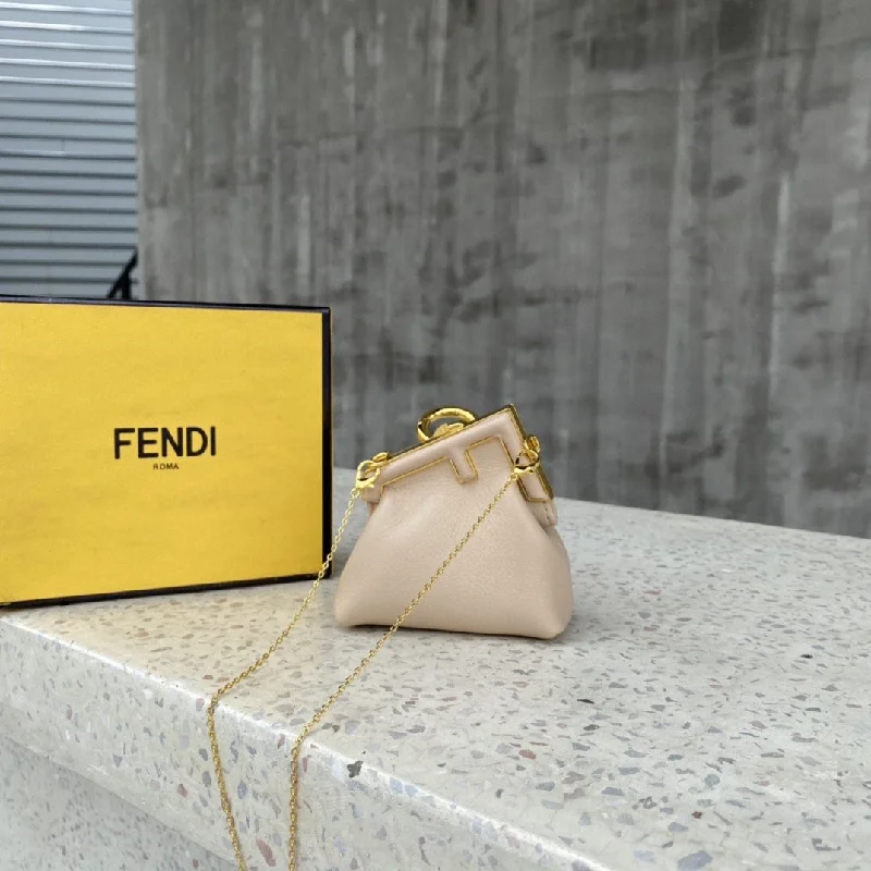 Fendi Baguette bags with a detachable charm featuring the brand's mascotFendi Nano Fendirst Charm Beige Bag For Woman 10cm/4in