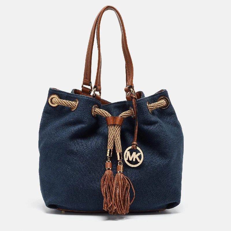 smooth leather Michael Michael Kors handbags for a sleek lookNavy Blue/Brown Canvas Marina Drawstring Tote