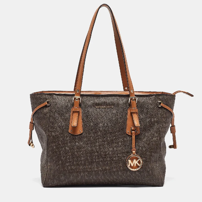 Michael Michael Kors Bags for product launches to match the brand's imageBrown Signature Coated Canvas and Leather Voyager Shopper Tote