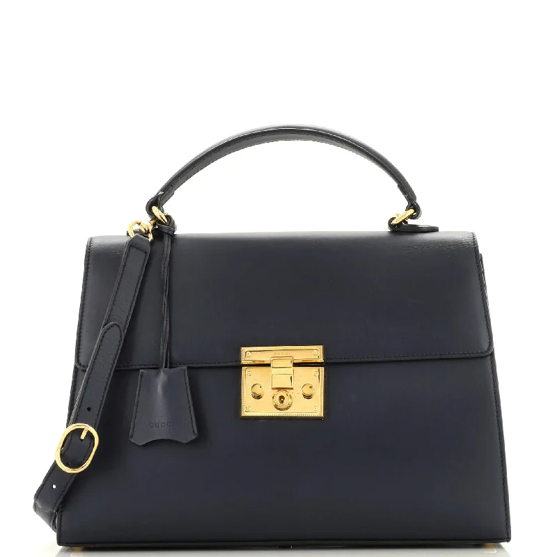 Christian Dior backpacks with a sleek, minimalist silhouettePadlock Top Handle Bag Leather Medium